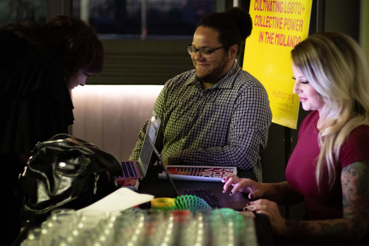 Students help check attendees in to the October 2019 kickoff event.