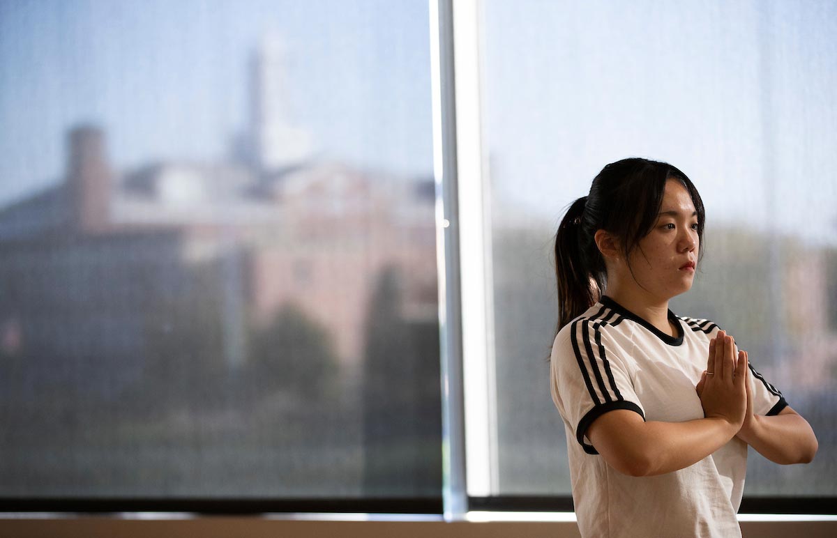 Lindsay Kneiper teaches a yoga class as part of the Physical Education Activities Program in the Health and Kinesiology Building