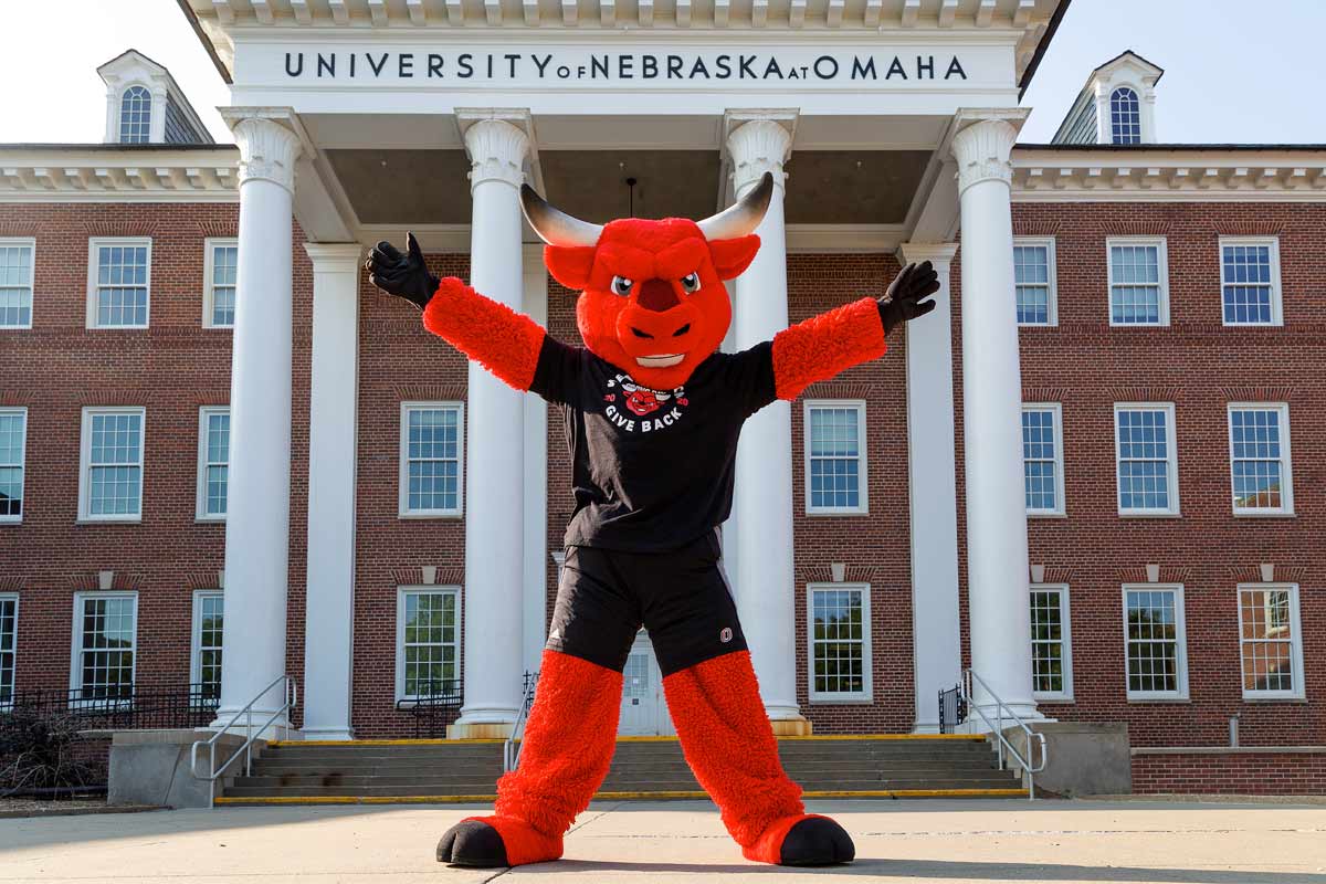 Durango poses outside of Arts and Sciences Hall