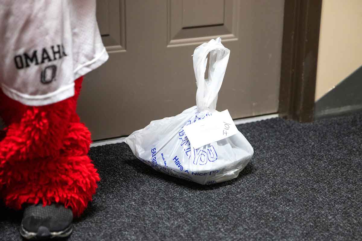 A bagged meal sits outside a student's door.