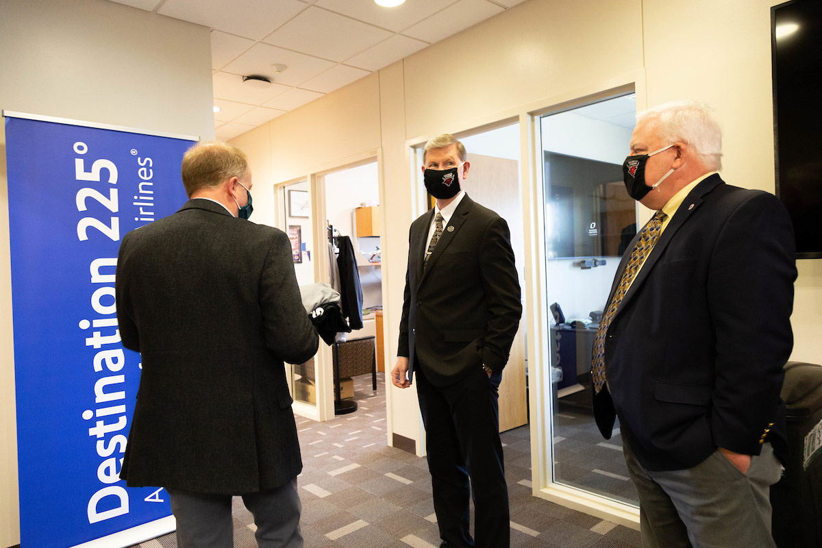 Carter talking with Aviation Institute Director and CPACS dean