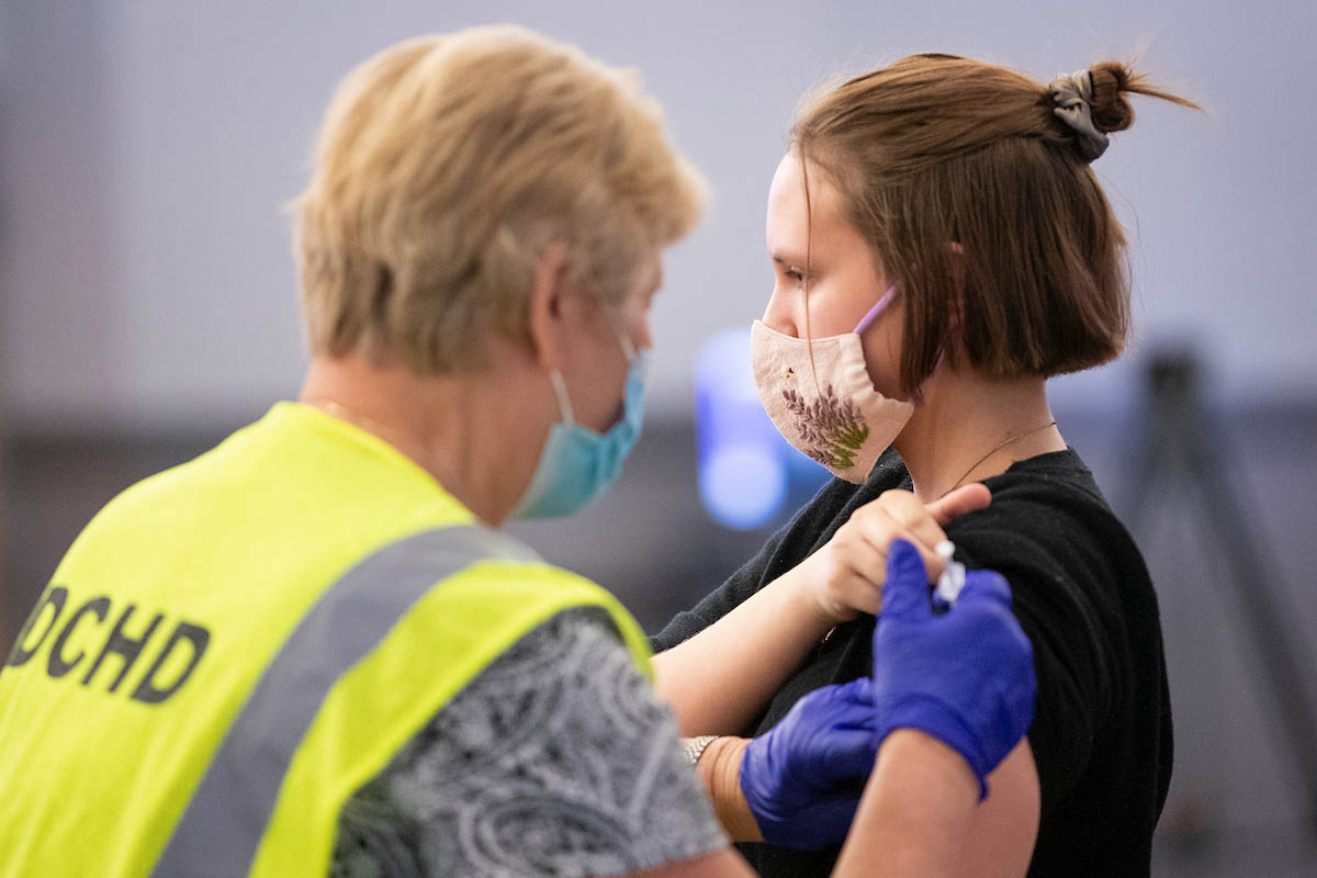 UNO student Minna Glover receives the COVID-19 vaccination.