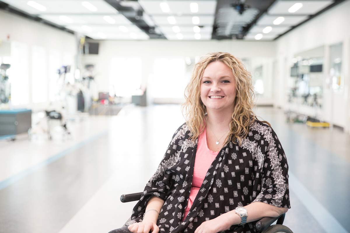 A photo of Taryn Schaaf at QLI, sitting in her wheelchair.