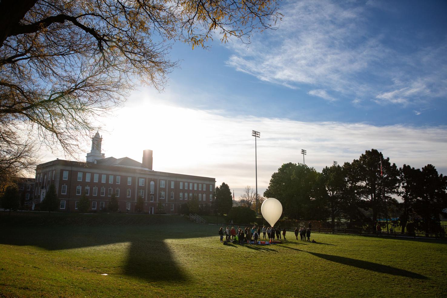 Derrick Nero conducts a high-altitude balloon launch with his class in the Pep Bowl at the University of Nebraska at Omaha.