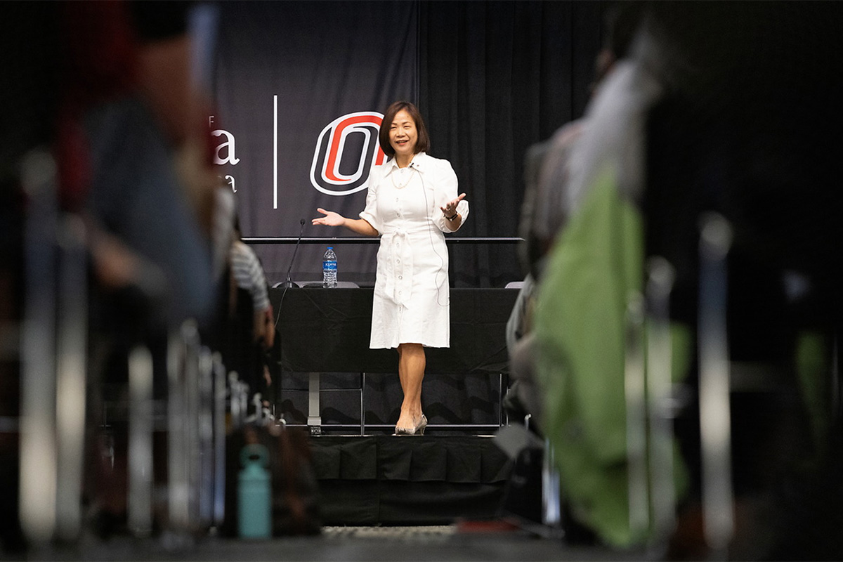 Chancellor Joanne Li, Ph.D., CFA, speaks to an in-person and virtual crowd during a UNO Campus Forum on Tuesday, Aug. 17.