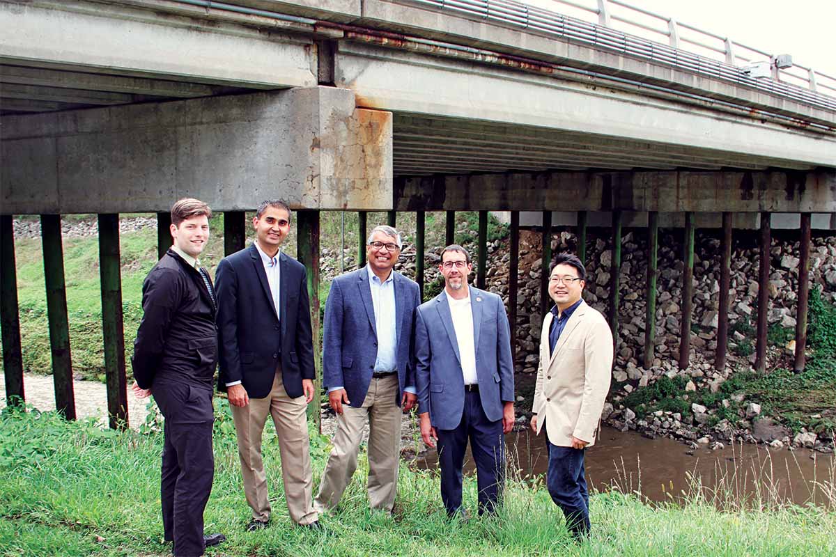 Researchers on this project from both UNO and UNL pose for a photo in front of one of the bridges in the study. Pictured are (from left) Brian Ricks, Ph.D., Robin Gandhi, Ph.D., Deepak Khazanchi, Ph.D., Daniel Linzell, Ph.D., and Chungwook Sim, Ph.D.