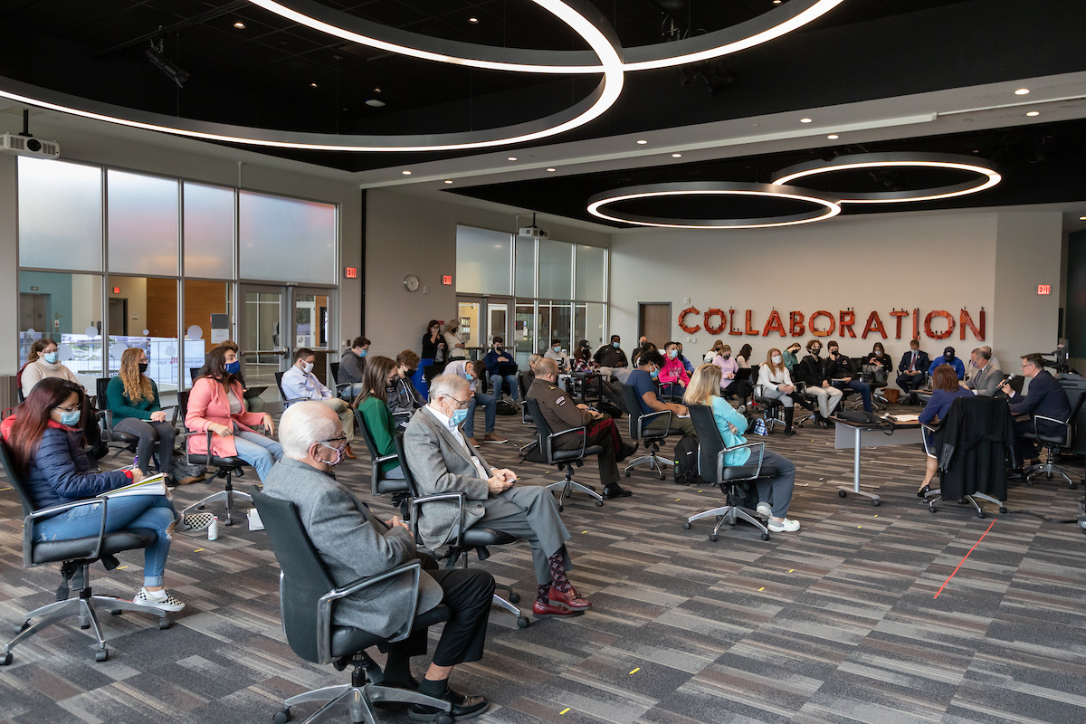 A crowd of students, faculty, staff, and members of the general public listen in as Jānis Garisons, state secretary of the Ministry of Defense of Latvia, Rep. Don Bacon (NE-02), UNO Chancellor Joanne Li, Ph.D., discuss Latvia's geopolitical situation at UNO’s Barbara Weitz Community Engagement Center