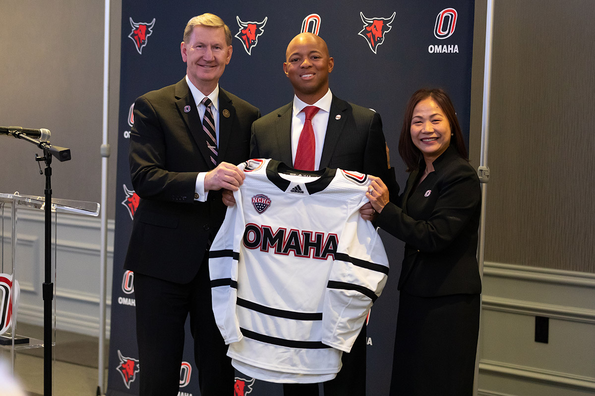 Adrian Dowell receives hockey jersey.