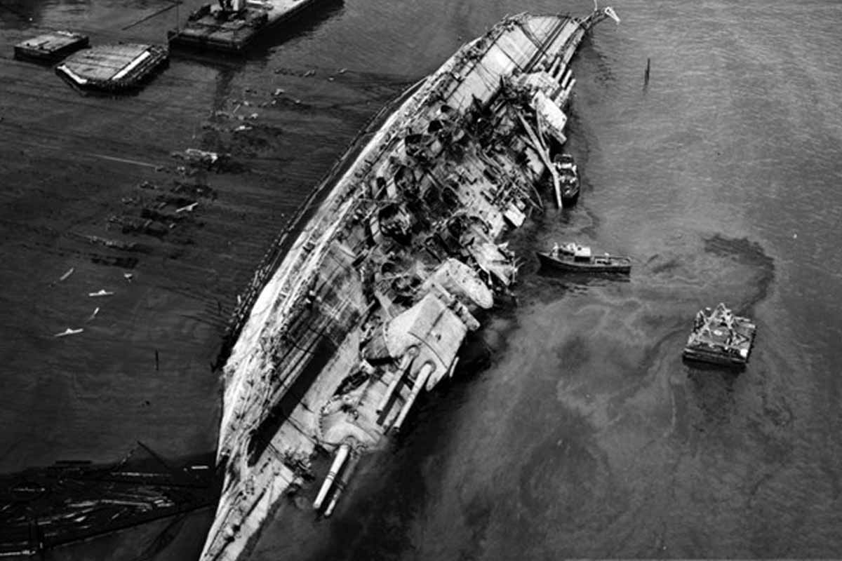 An archival photo of the capsized USS Oklahoma