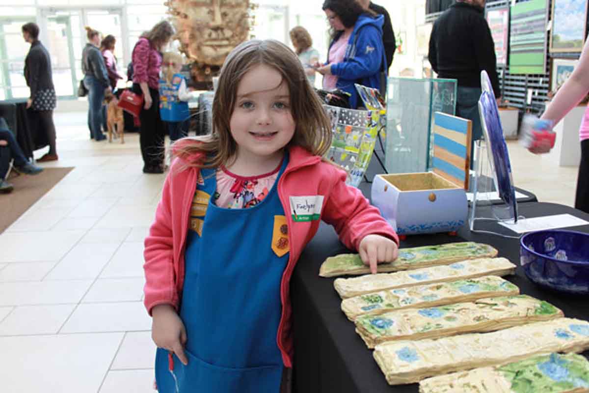 A young girl enjoys ArtVenture at Mammel Hall