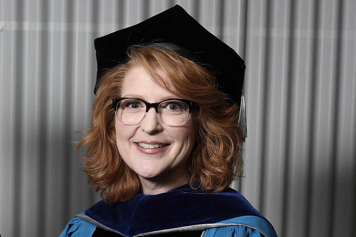Kerry Beldin receives the 2019 Chancellor's Medal during UNO's May 2019 Commencement