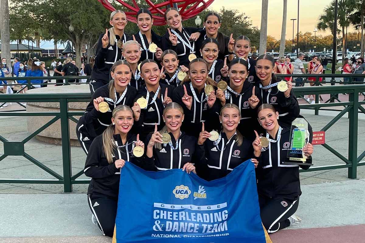 The UNO Dance Team shows off the new championship hardware at the 2022 Universal Dance Association national championship where they secured their second national championship.