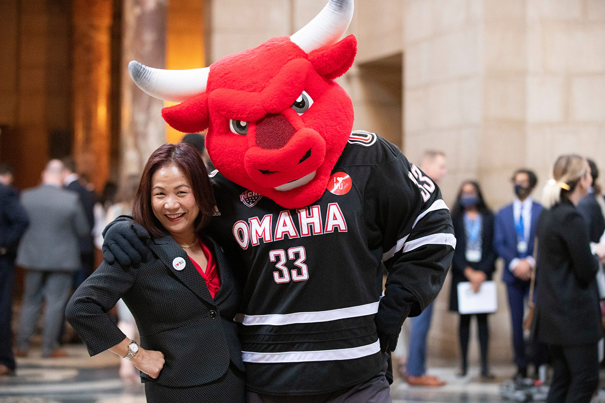 Chancellor Joanne Li, Ph.D., CFA, and Durango at the Nebraska State Capitol during "I Love NU" Day.