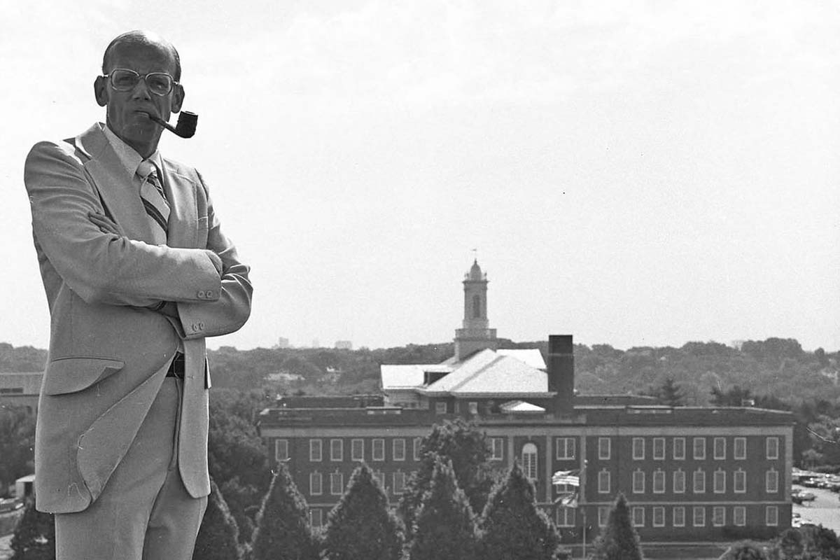 Ronald Roskens in front of Arts and Sciences Hall