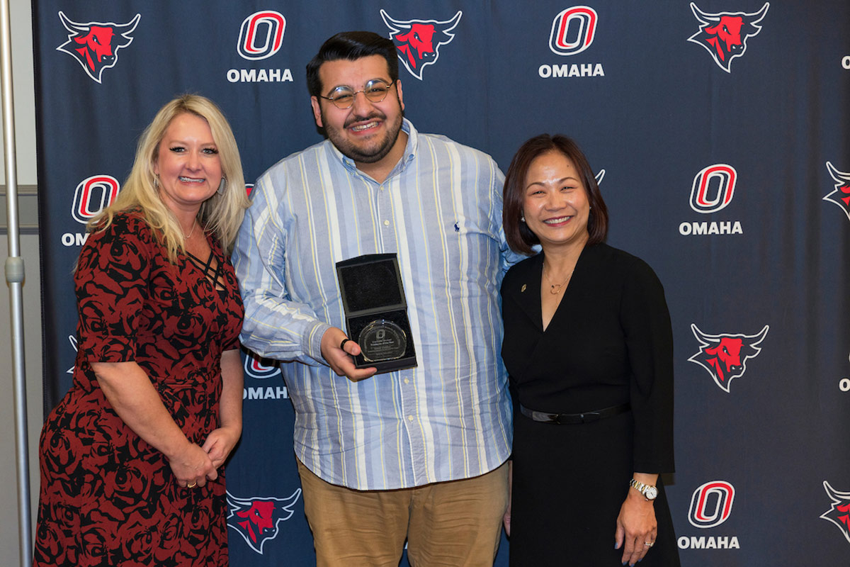 Saeed Dabbour (Graduate Assistant for the CADRE Project in Teacher Education) and UNO Chancellor Joanne Li, Ph.D., CFA.