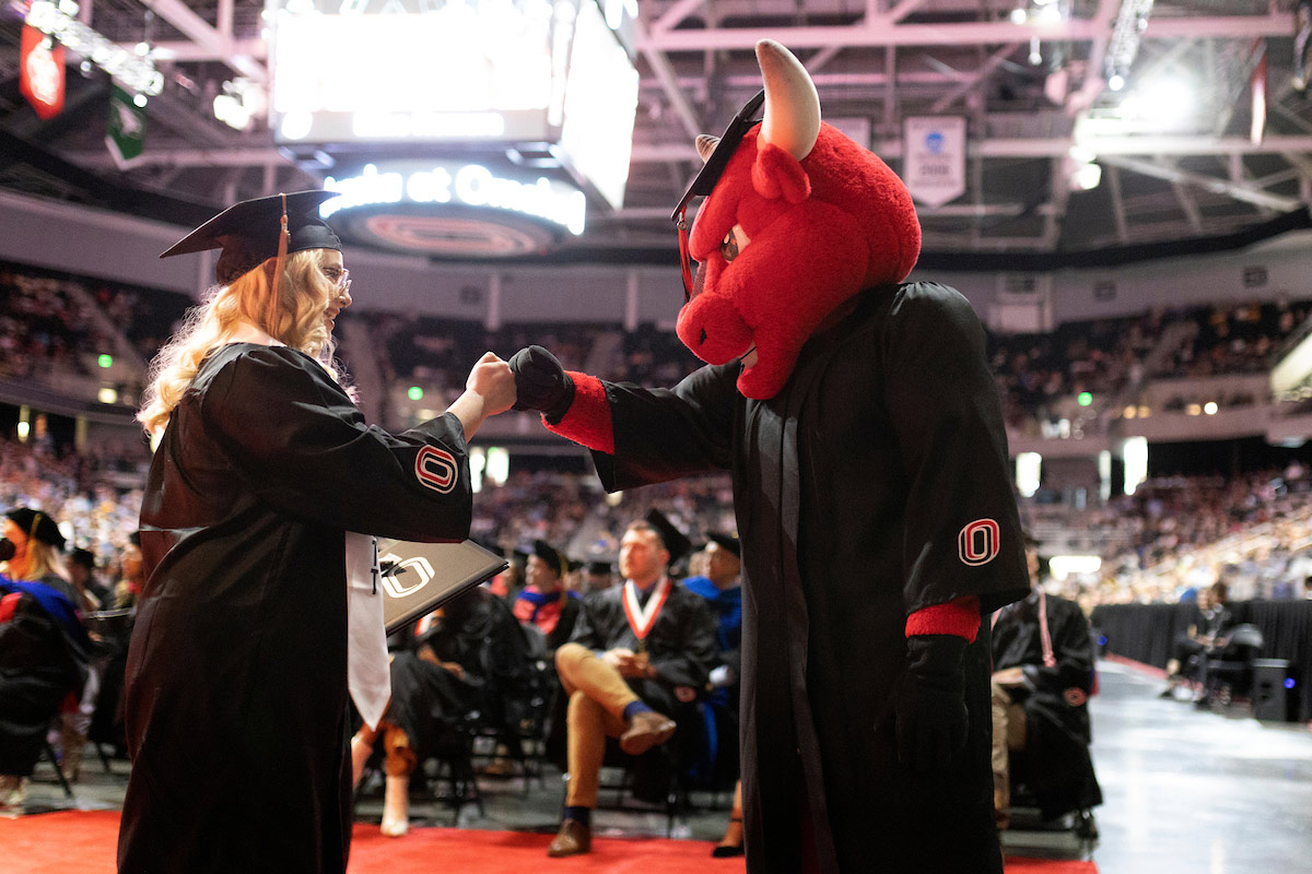 Durango greets a new graduate with a fist bump