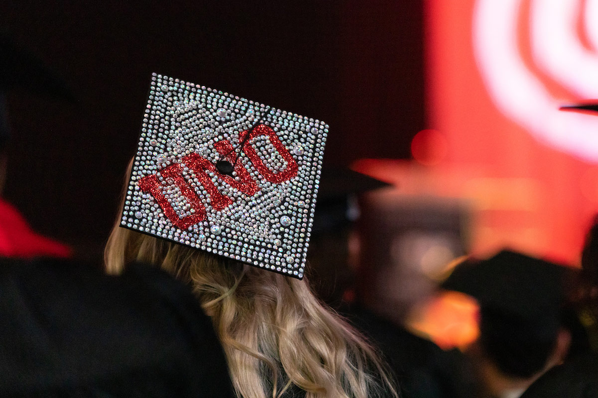 graduation cap decorated to spell UNO