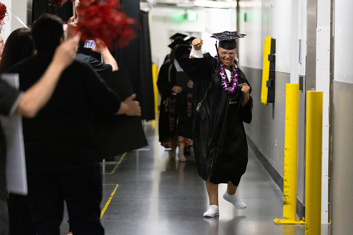 After receiving her diploma, Adams joined her fellow graduates backstage for the tunnel walk with members of the UNO Alumni family.
