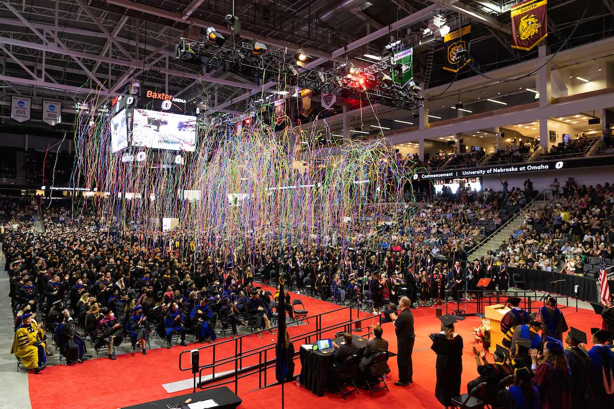 Confetti falls over the newest UNO alumni at the conclusion of the ceremony