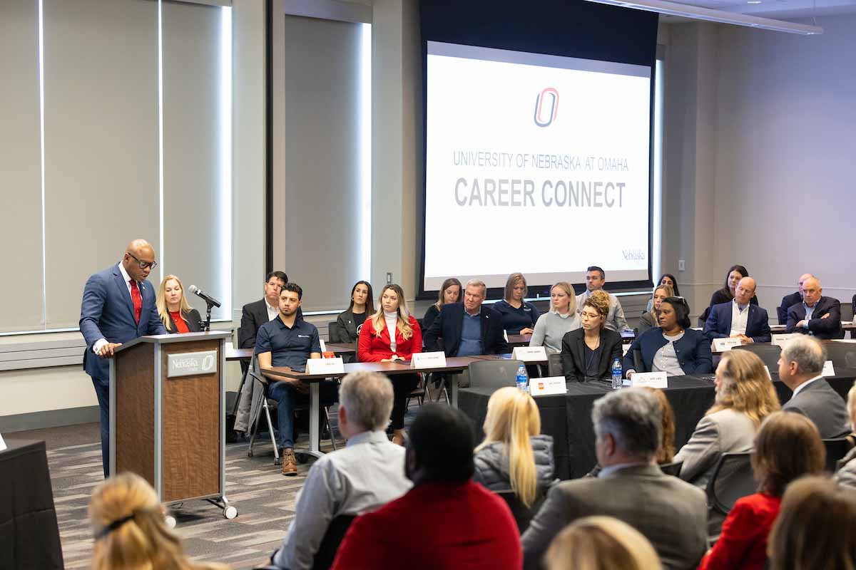 Anthony Goins speaks to a crowd of UNO faculty, staff, and students