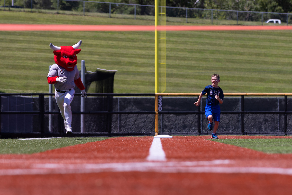 Durango and Logan race on the baseball field