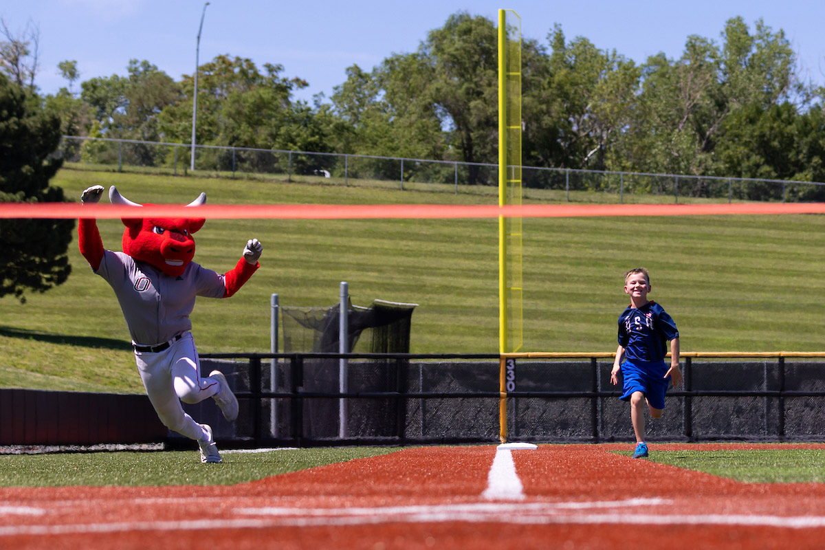 Durango and Logan race on the baseball field