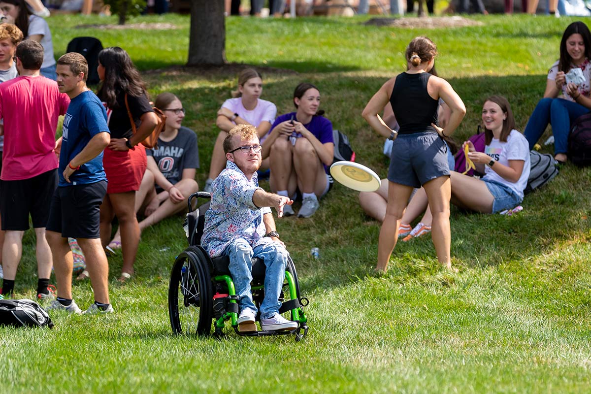 Student throws frisbee during Durango Days