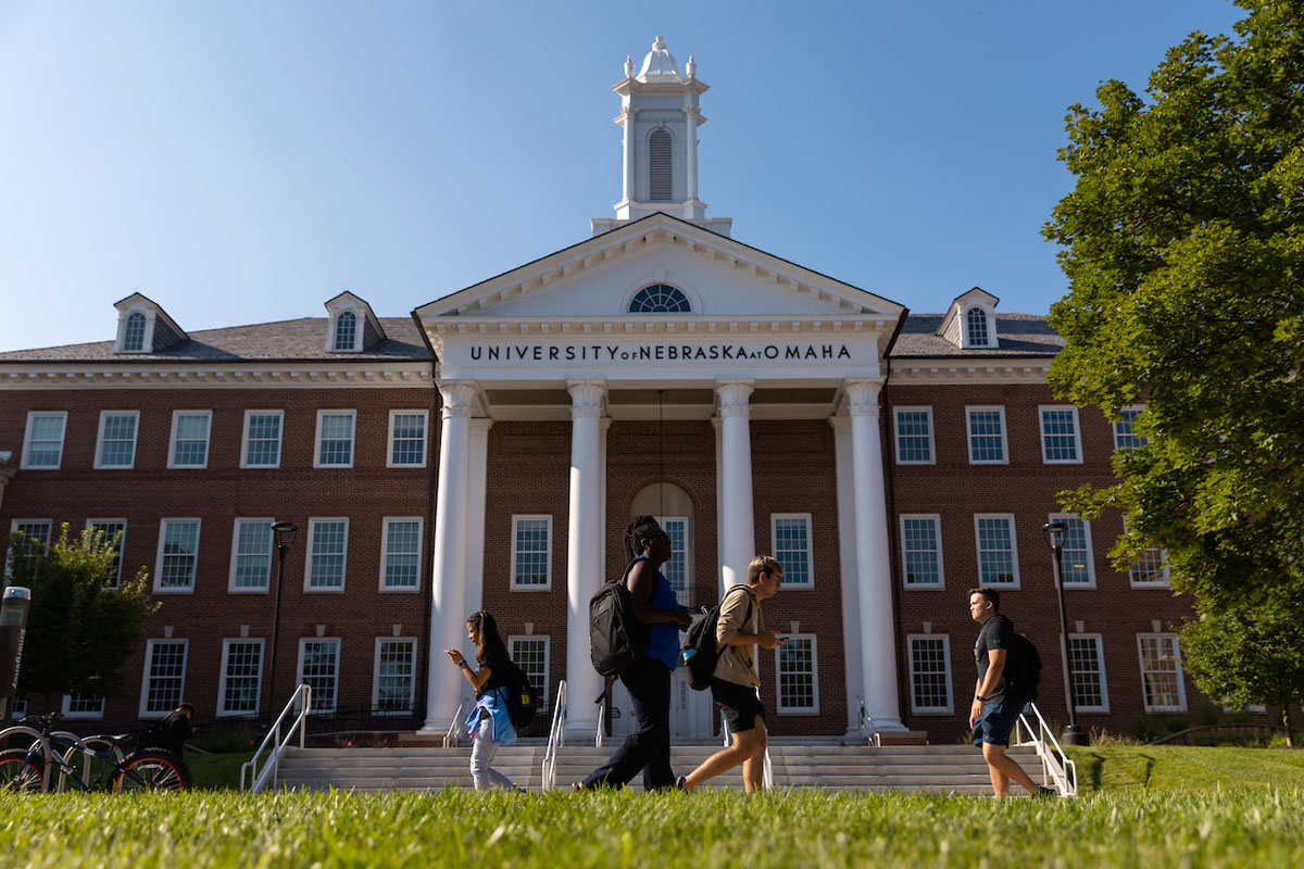  Students walk in front of Arts and Sciences Hall on the University of Nebraska at Omaha (UNO) Dodge campus on the first day of the fall 2022 semester.