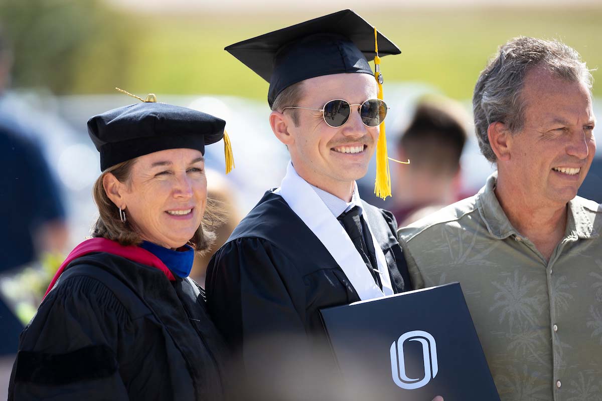 Becky Lutte (left), Scott Lutte (center), and Steve Lutte (right) celebrate Scott's graduation.