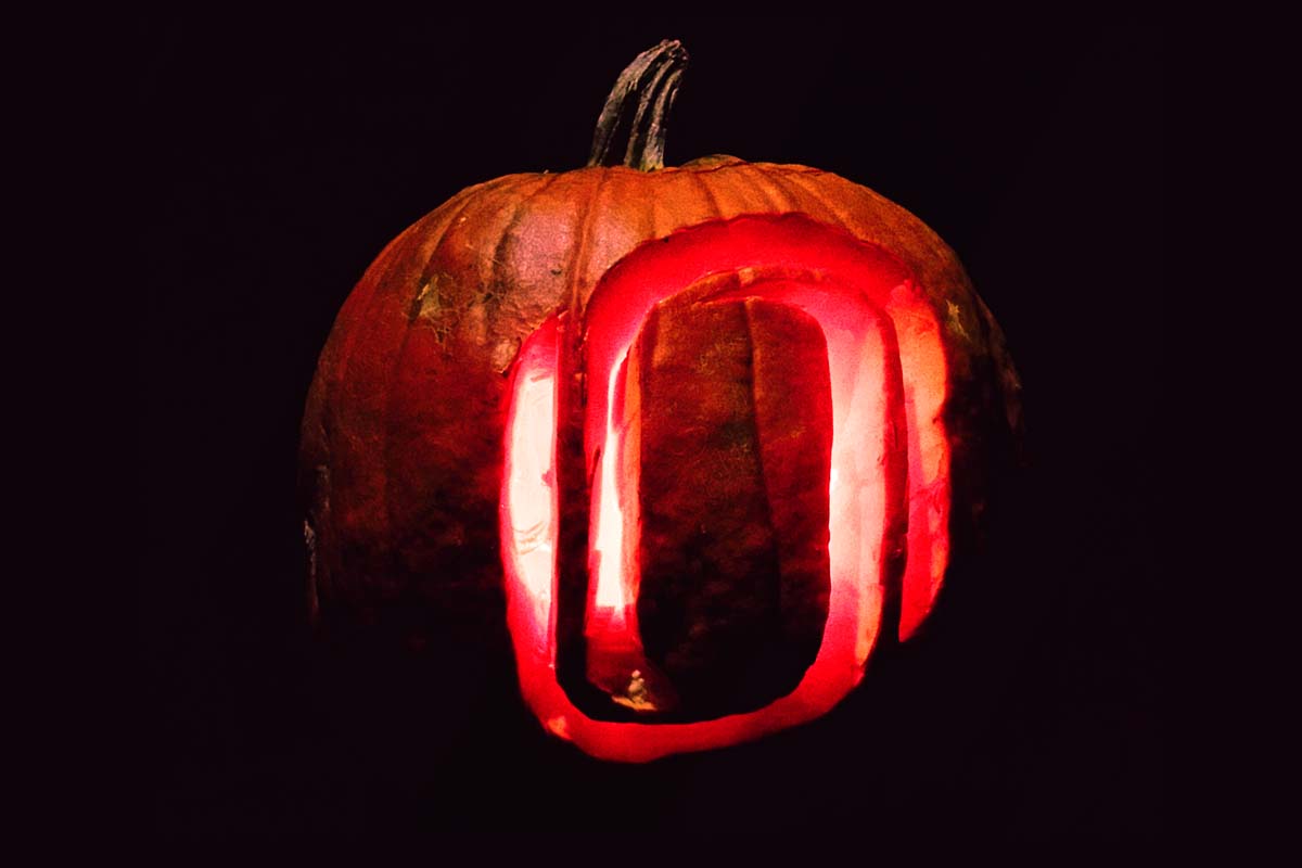 A jack-o-lantern with the UNO "O" carved into it