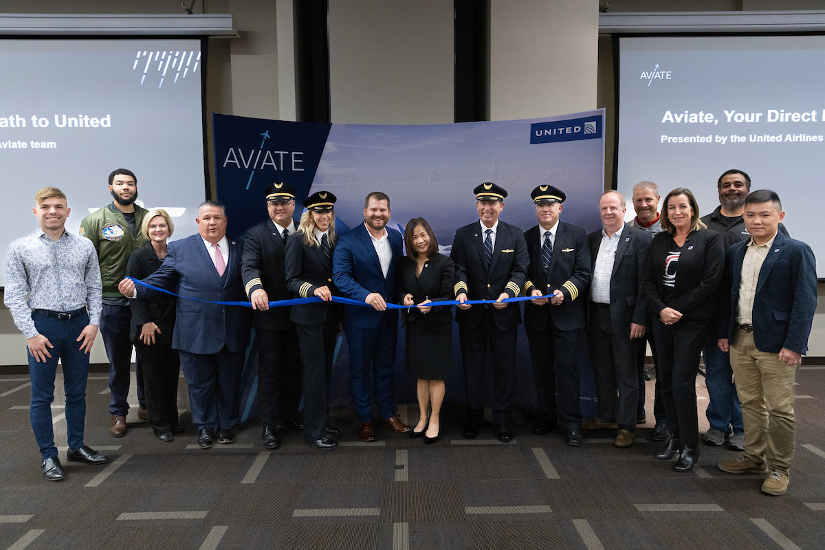 The ribbon cutting ceremony celebrating UNO's new partnership with United Airlines.