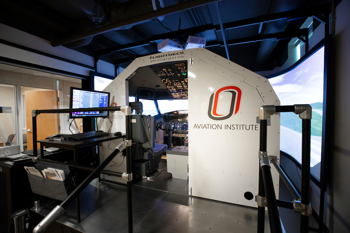 The back side of the simulator opens up, allowing instructors to teach a full class of students while their colleagues take their turn piloting the virtual aircraft.