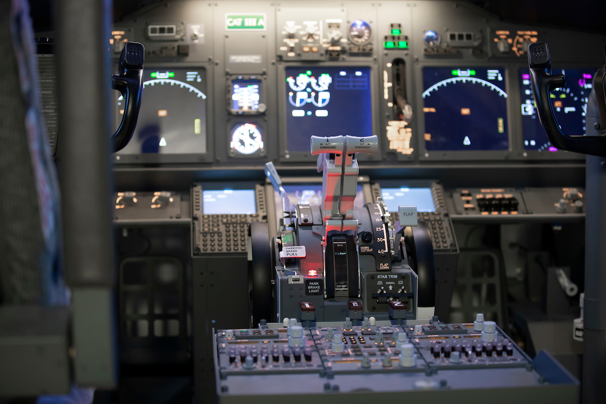 Using a simulator with actual aircraft yokes, buttons, switches, gauges, and other instruments allows students to develop a physical, spatial connection to the environment they will be working in.