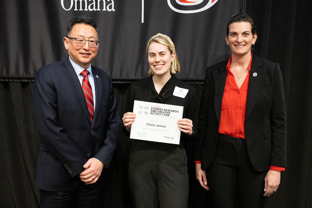 award recipient poses at the Student Research and Creative Activity Fair