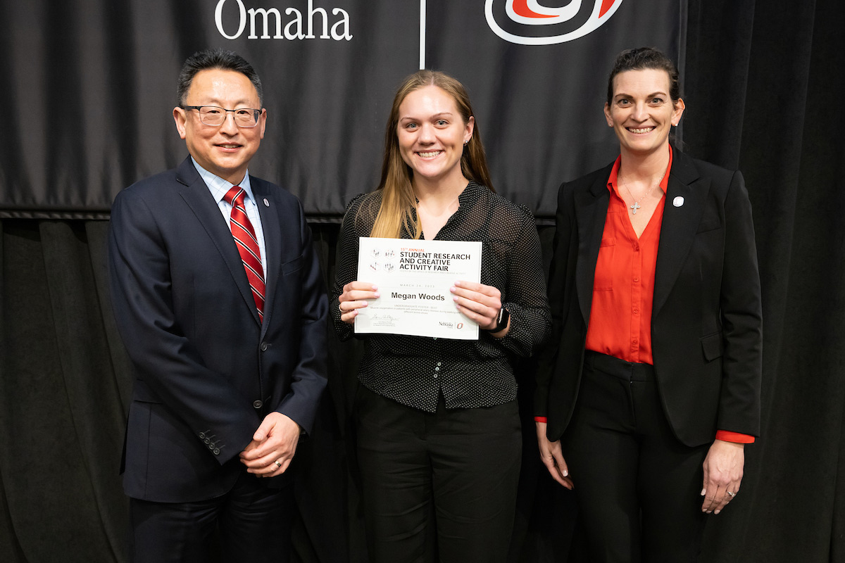 award recipient poses at the Student Research and Creative Activity Fair