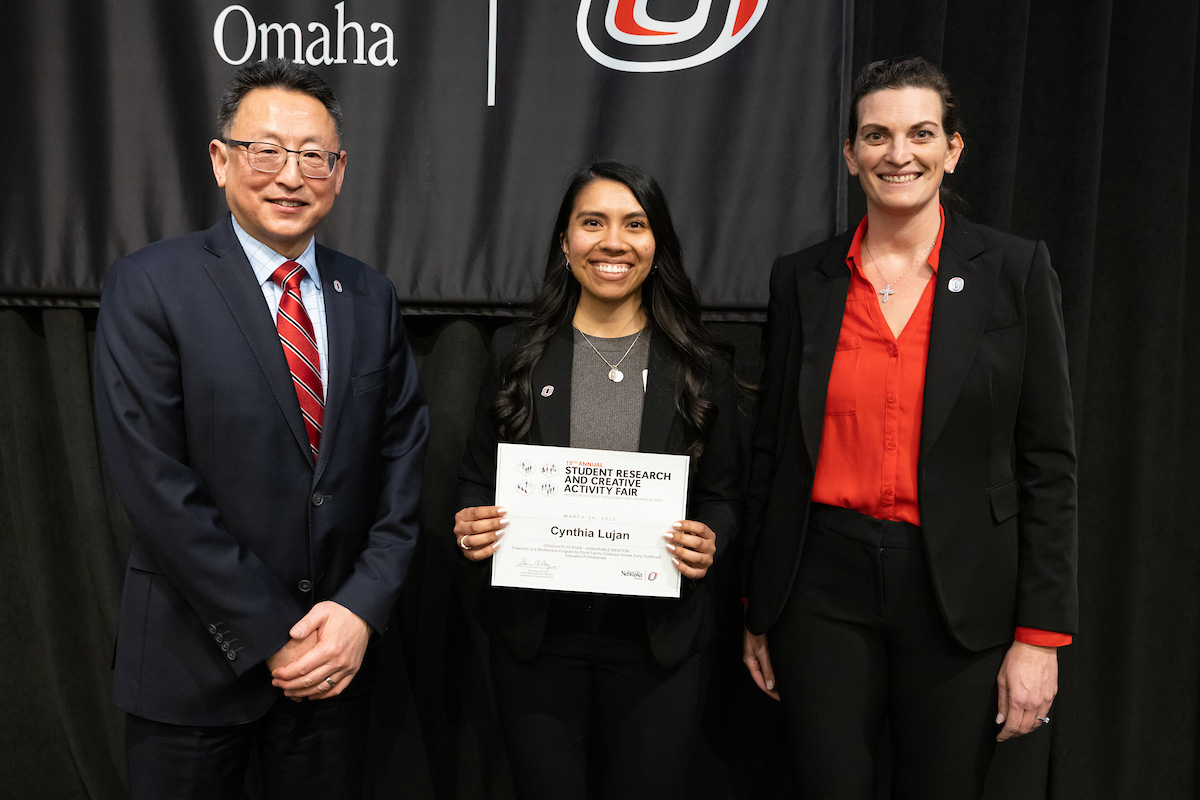 award recipient poses at the Student Research and Creative Activity Fair