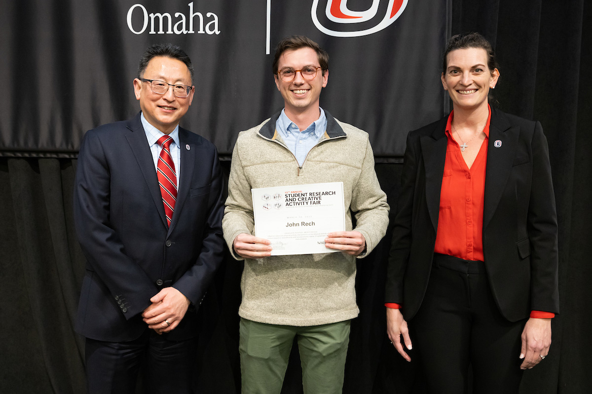 award recipient poses at the Student Research and Creative Activity Fair