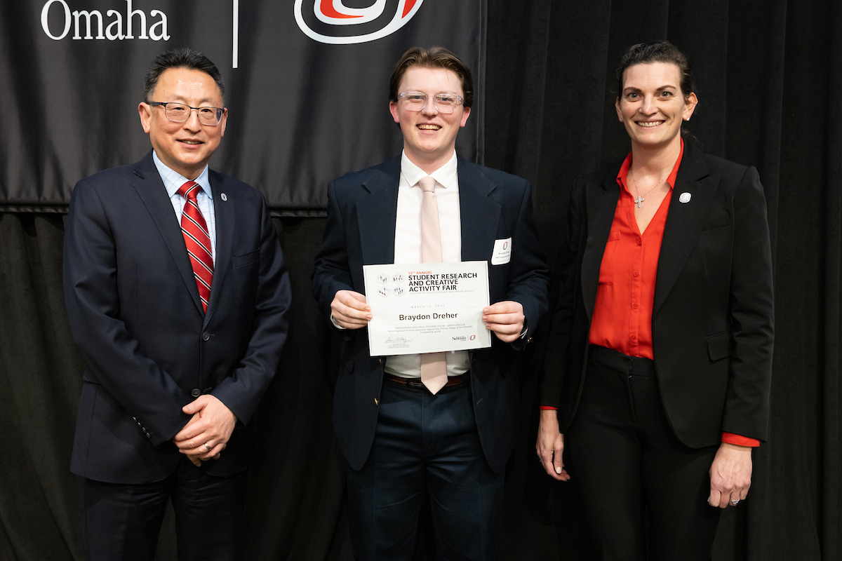 award recipient poses at the Student Research and Creative Activity Fair