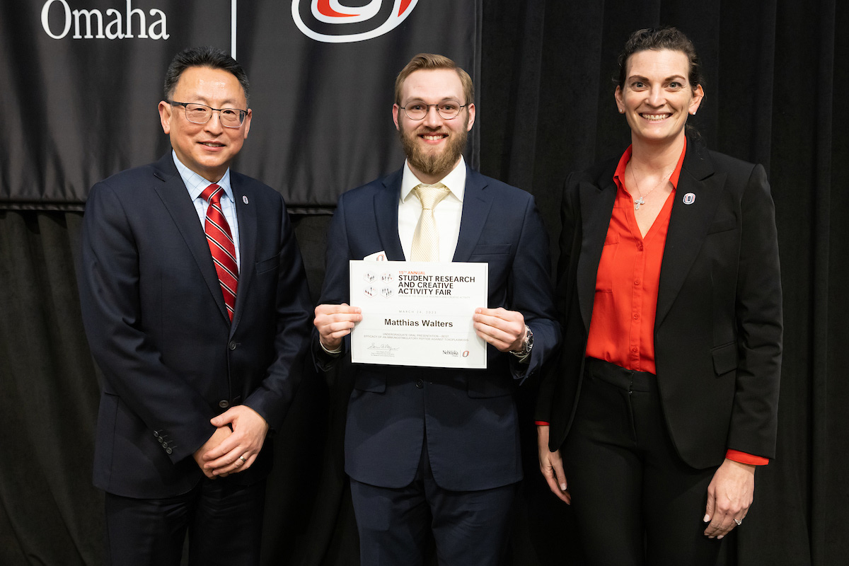 award recipient poses at the Student Research and Creative Activity Fair