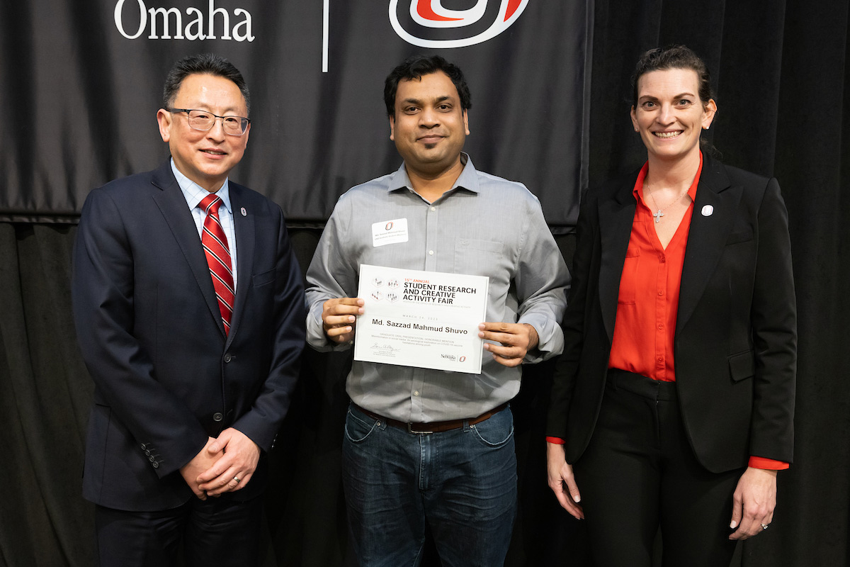 award recipient poses at the Student Research and Creative Activity Fair