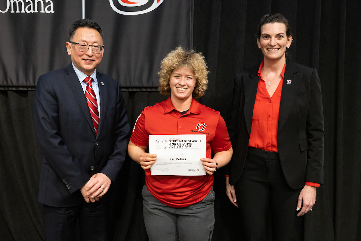 award recipient poses at the Student Research and Creative Activity Fair