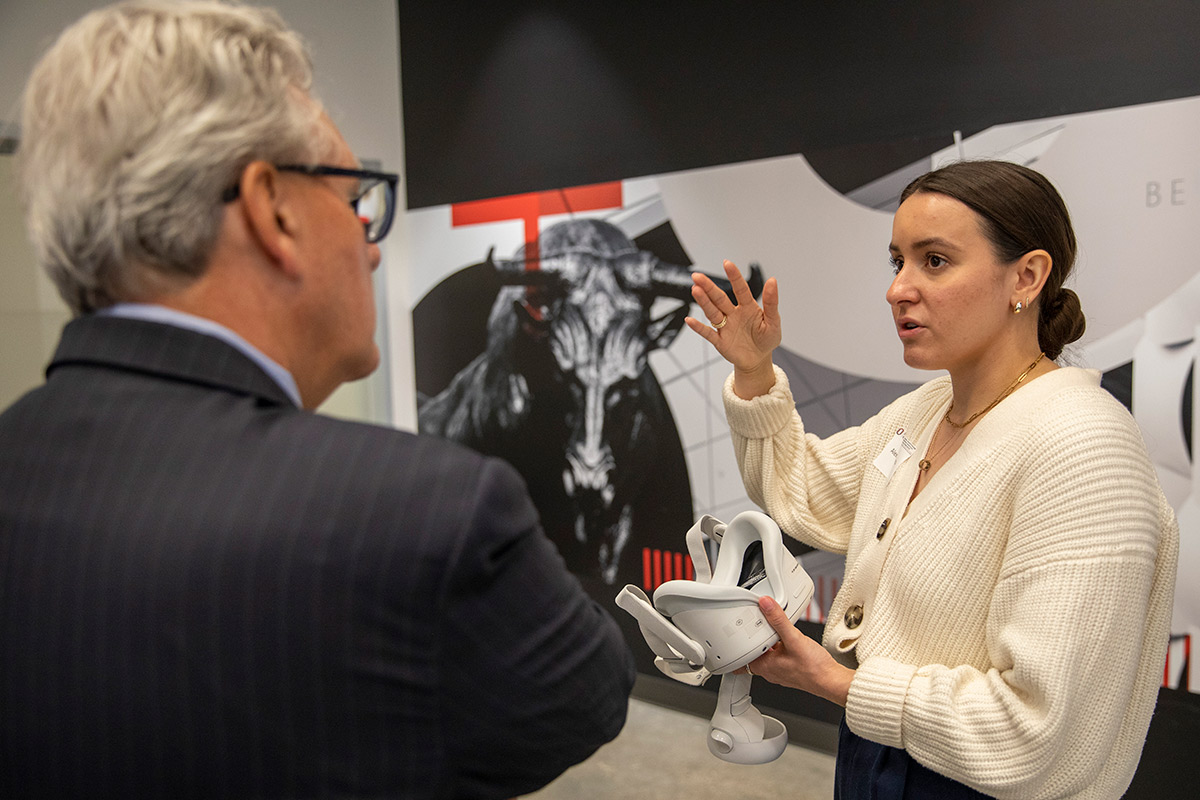 UNO College of Business Administration student Alexis d'Amato meeting with Regent Scheer.