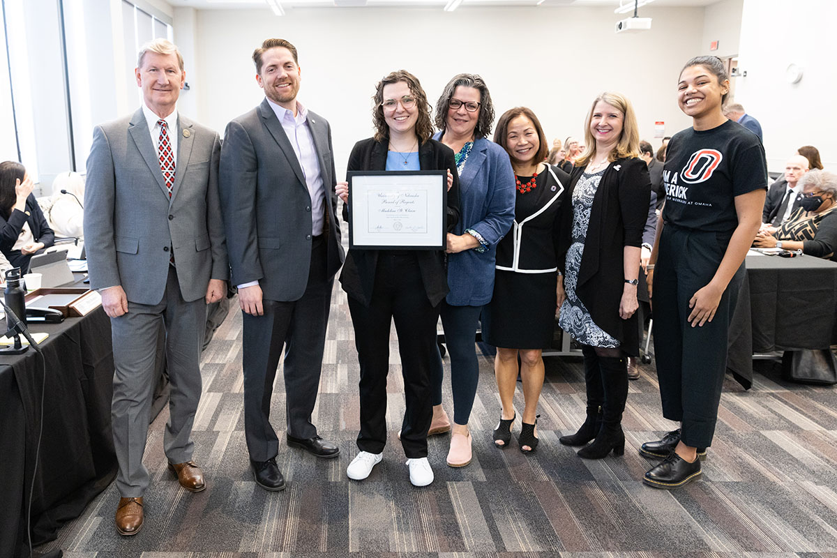 Madeline St. Clair receiving the KUDOS Award