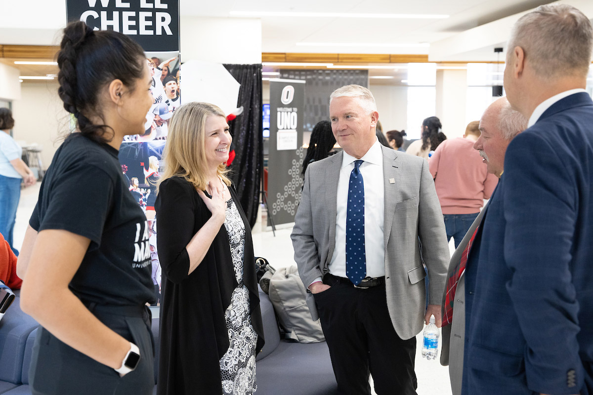 Associate Vice Chancellor and Dean of Students Cathy Pettid and UNO Student Body President/Regent Tori Sims speak with members of the Board of Regents