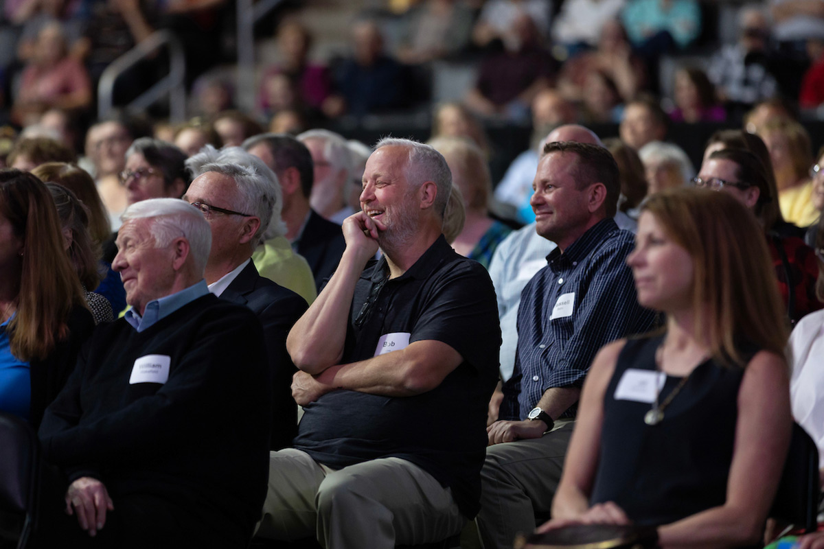 Audience member laughing.