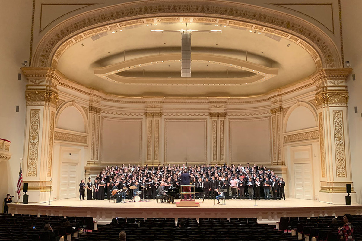 Derrick Fox, DMA, director of choral activities and distinguished associate professor of music at UNO, leads roughly 250 singers in a rehearsal before an unforgettable performance at famed music venue Carnegie Hall in New York City. Photo credit: Rob Chesire.