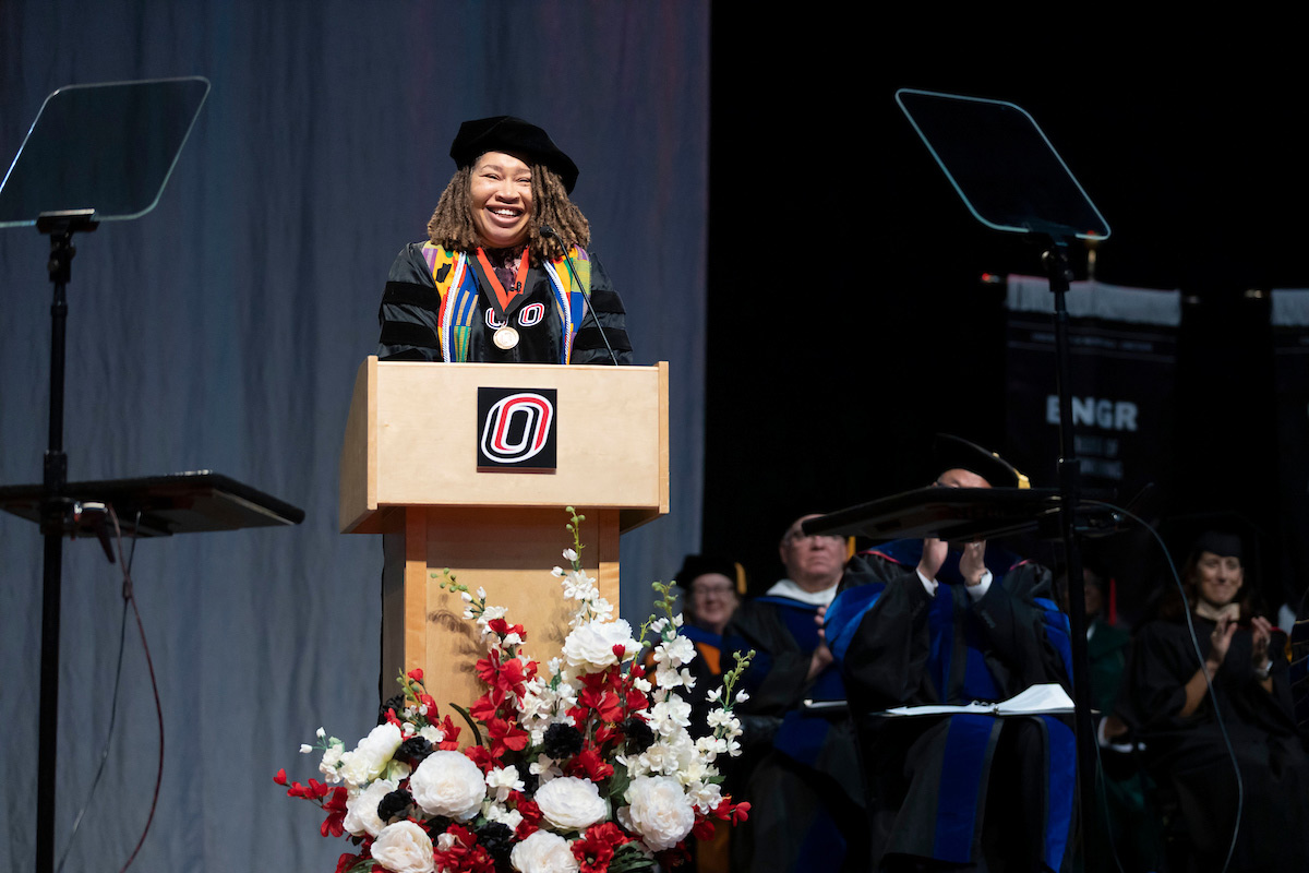 DérNecia Phillips at the podium during May 2023 Commencement.