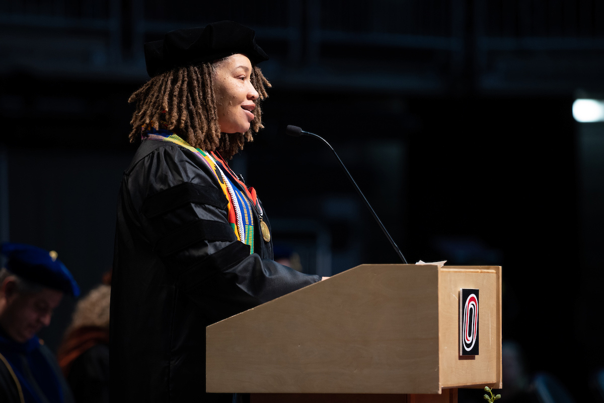 DérNecia Phillips at the podium during May 2023 Commencement.