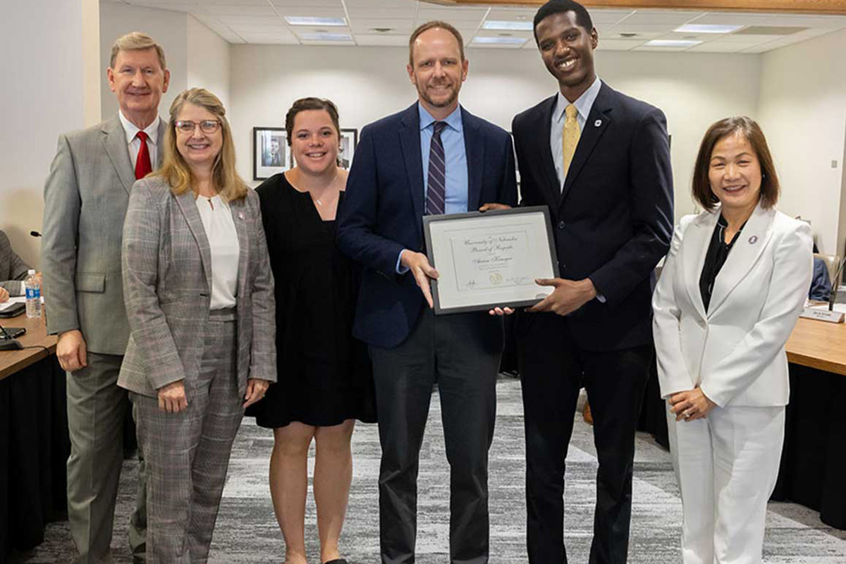 Pictured: President Carter; Dr. Cathy Pettid, Associate Vice Chancellor for Student Life & Wellbeing, and Dean of Students; Alli Devney, colleague; Aaron Krueger, recipient; Regent Lotoro; Chancellor Li.