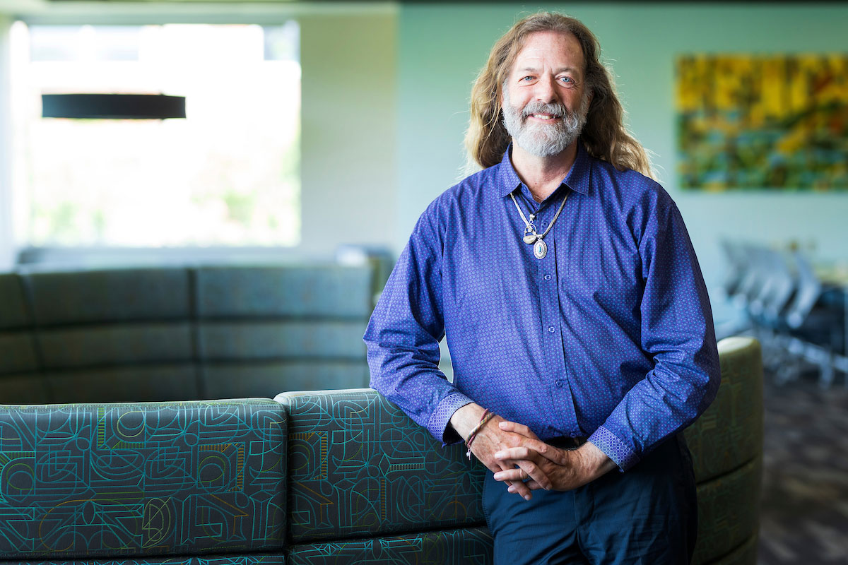 Chief Diversity Officer, A.T. Miller, Ph.D. stands in the CEC commons